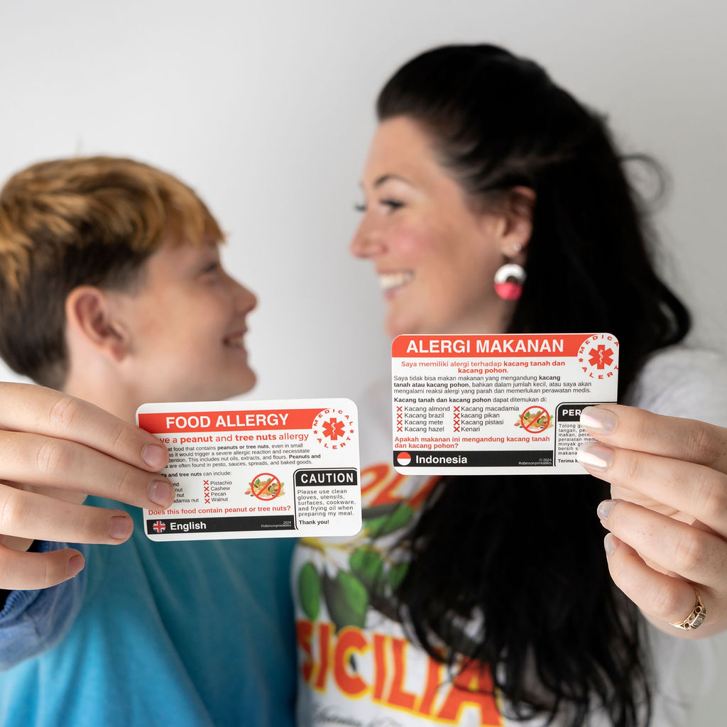 Woman and young boy with allergy cards